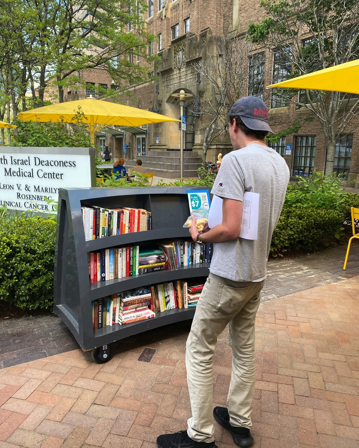 LMA member browsing one of the Outside// book shelves. 