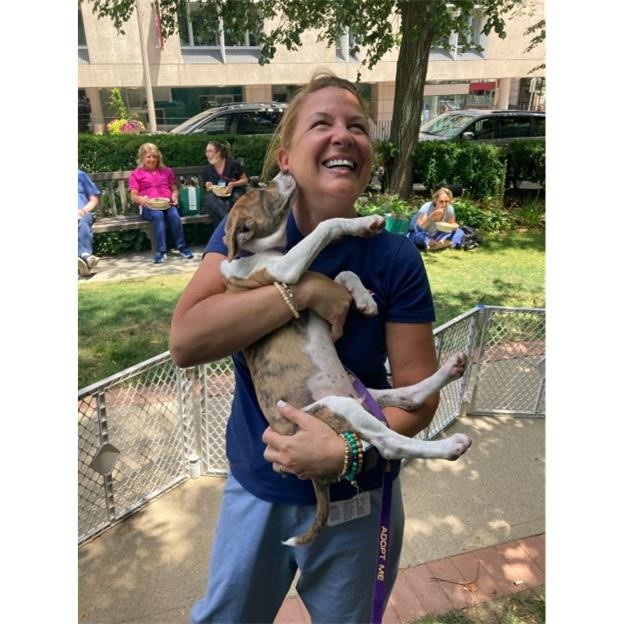 LMA member holding puppy during Wag Wednesday event