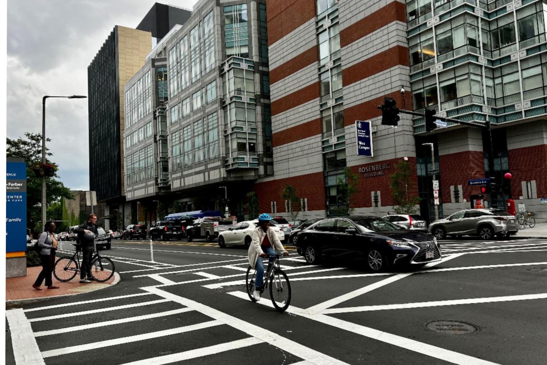 Bicyclist using re-striped bike path on Brookline Avenue