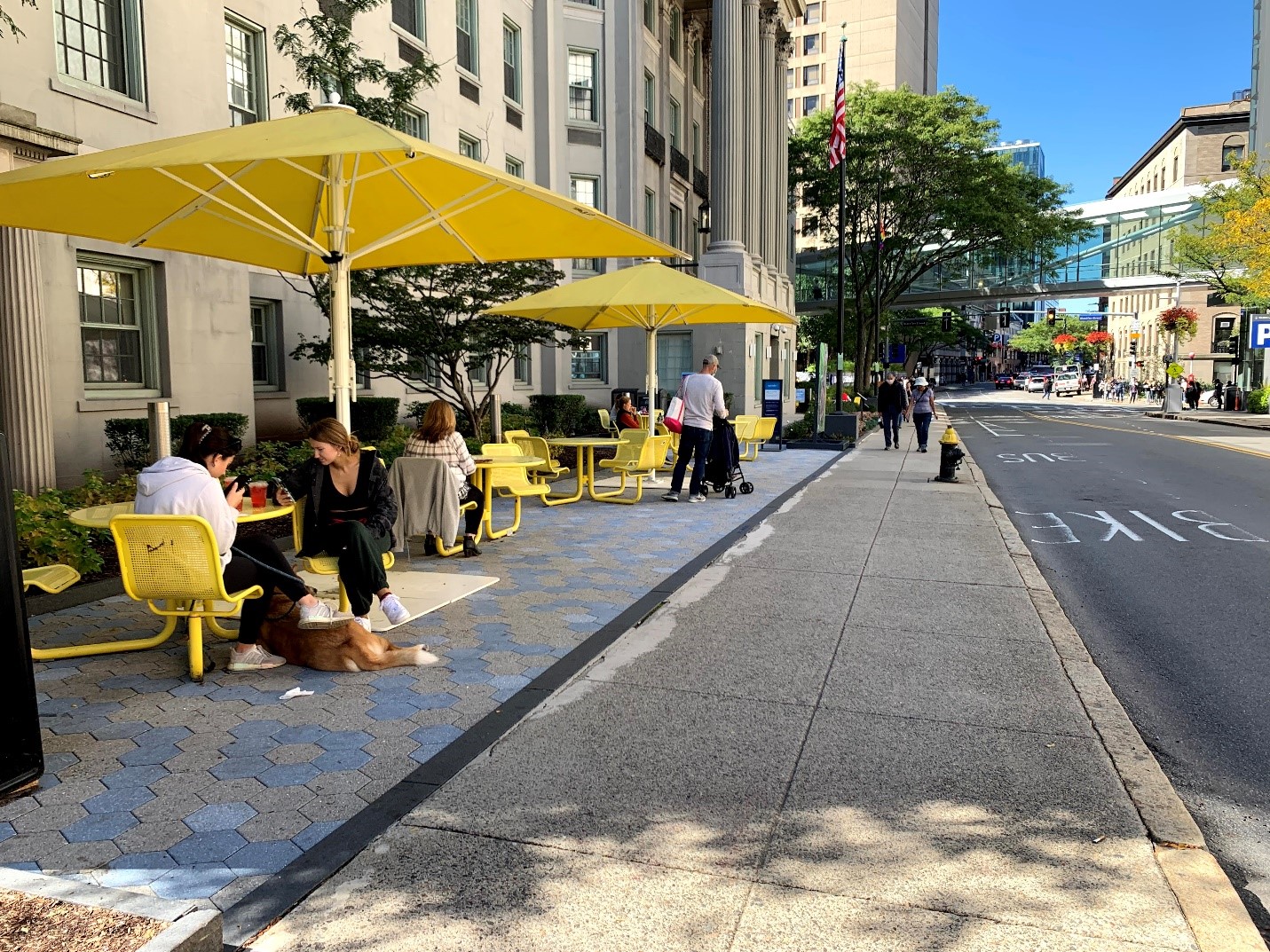 Outside// program tables, chairs and umbrellas in front of BCH