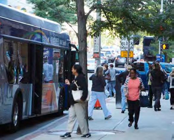 Commuters by shuttle bus and foot in the LMA