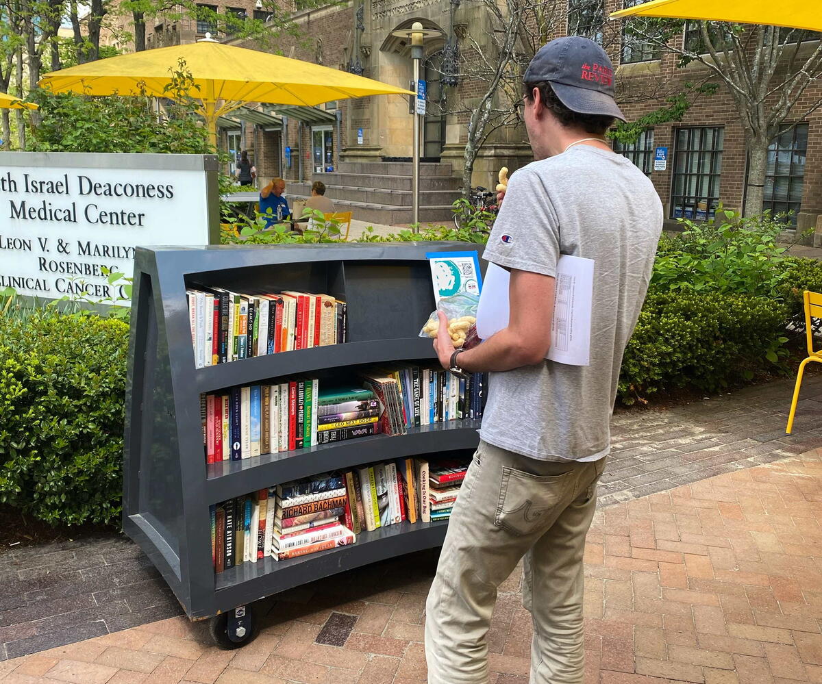Person checks out Book Cart
