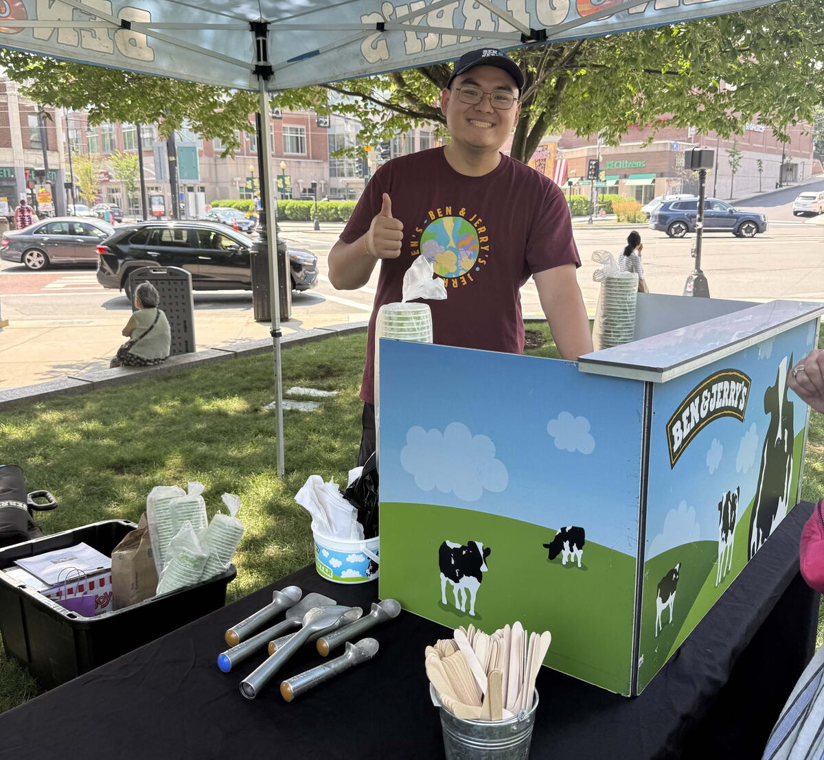 Ben and jerry's staff pose smiling
